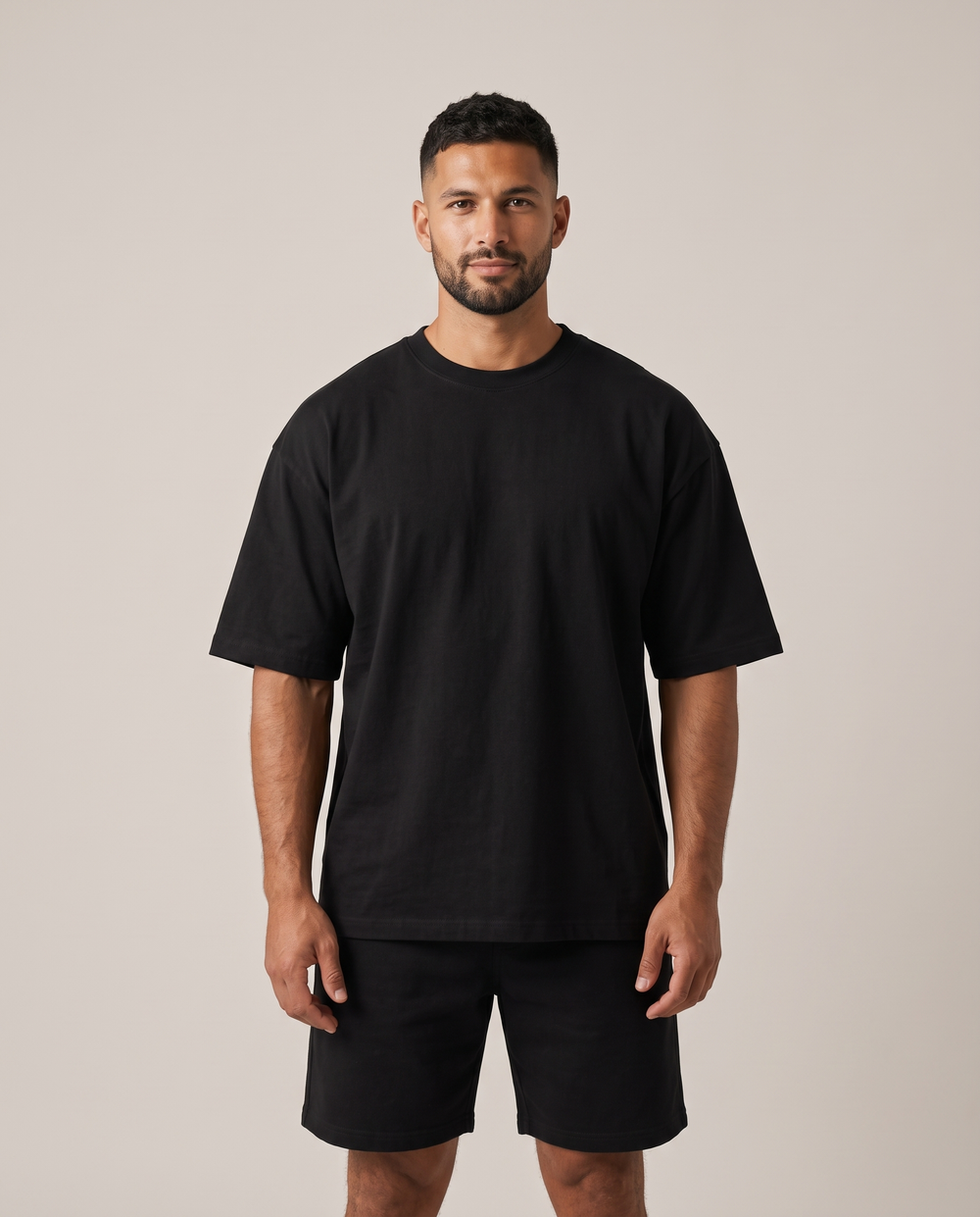 Model wearing the GRUD Heavyweight Oversized Tee in black, front view