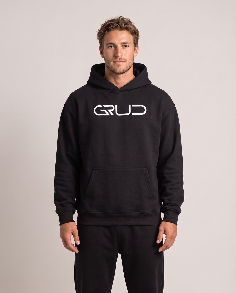Model wearing the GRUD Heavyweight Hoodie in black, front view