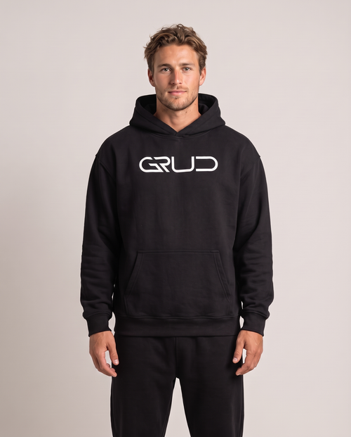 Model wearing the GRUD Heavyweight Hoodie in black, front view