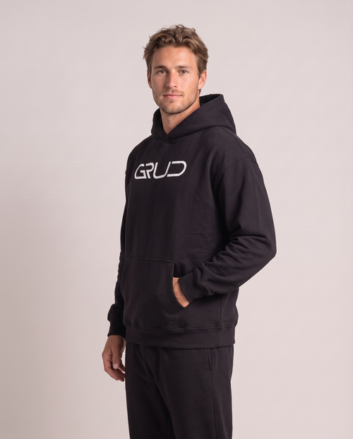 GRUD Heavyweight Hoodie in black, three-quarter view