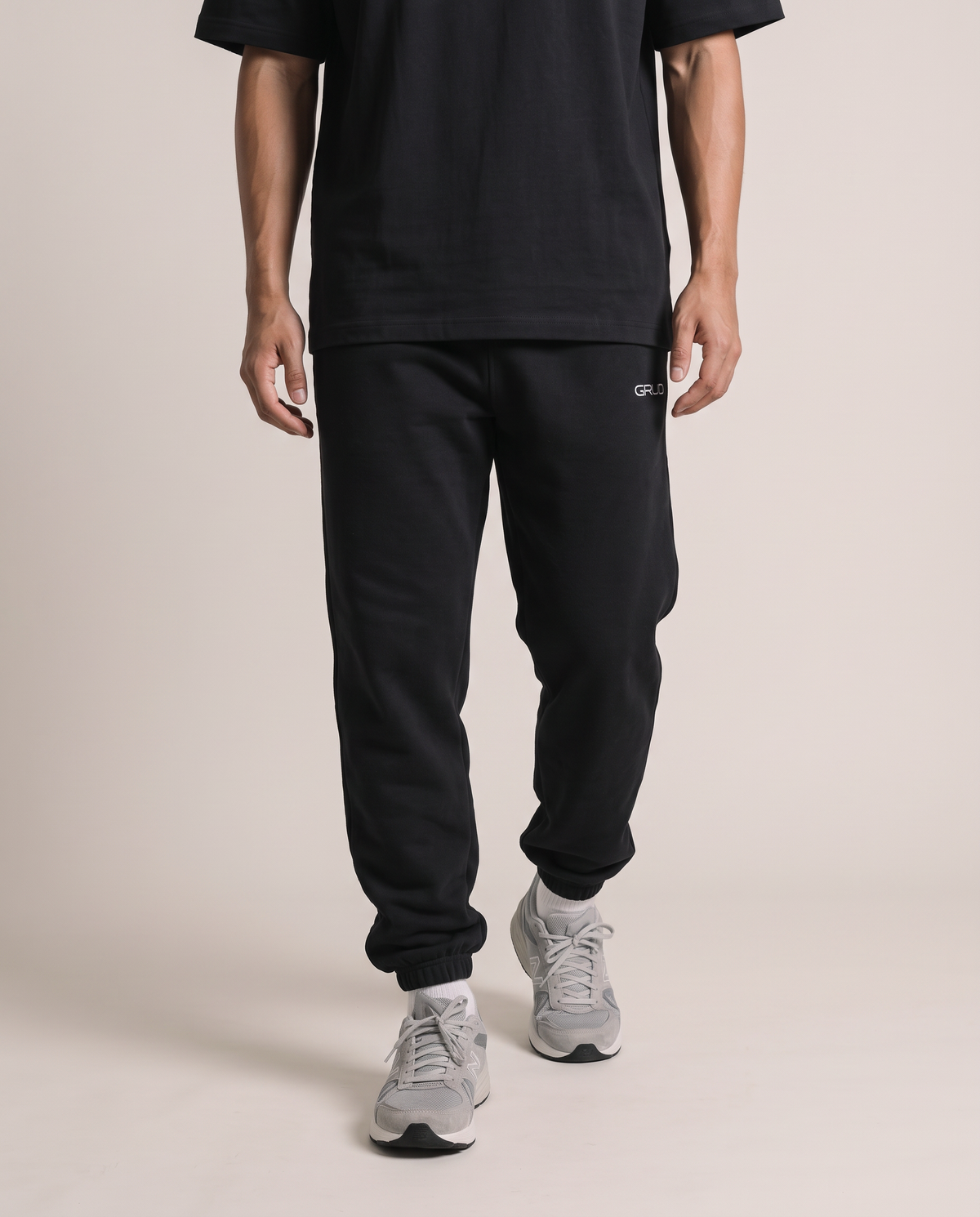 GRUD Essentials Sweat Pants in black, tapered leg and cuffed ankles