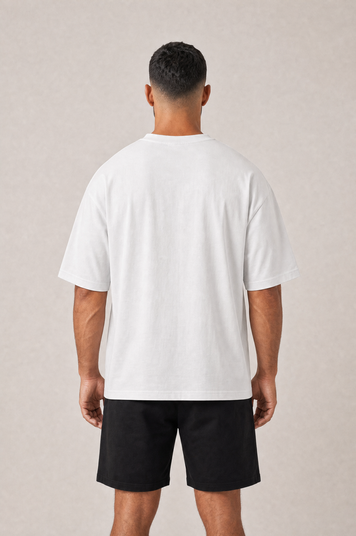 Model wearing the GRUD Heavyweight Oversized Tee in white, back view