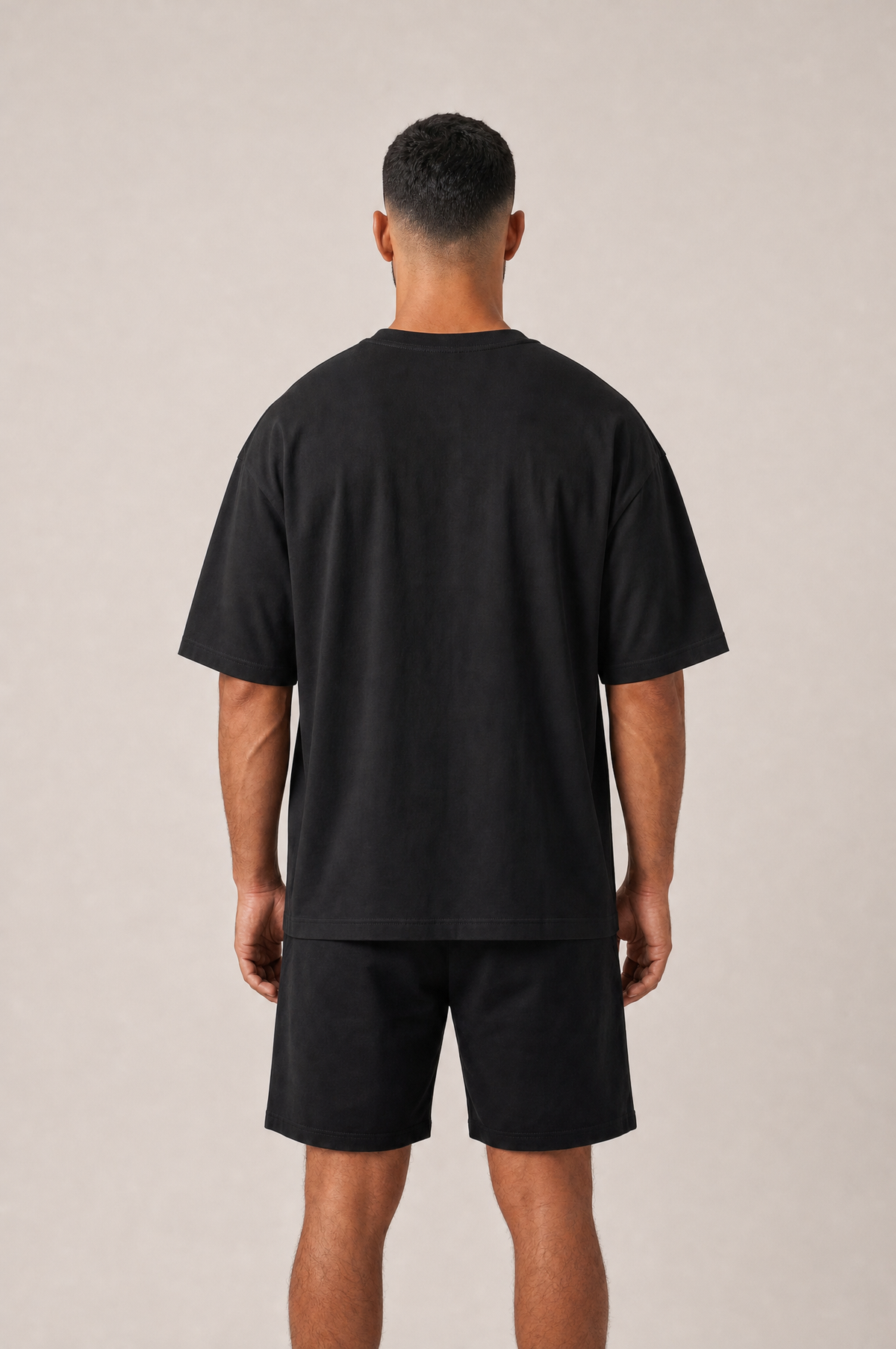 Model wearing the GRUD Heavyweight Oversized Tee in black, back view